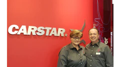 CARSTAR automotive service logo with two employees in matching shirts