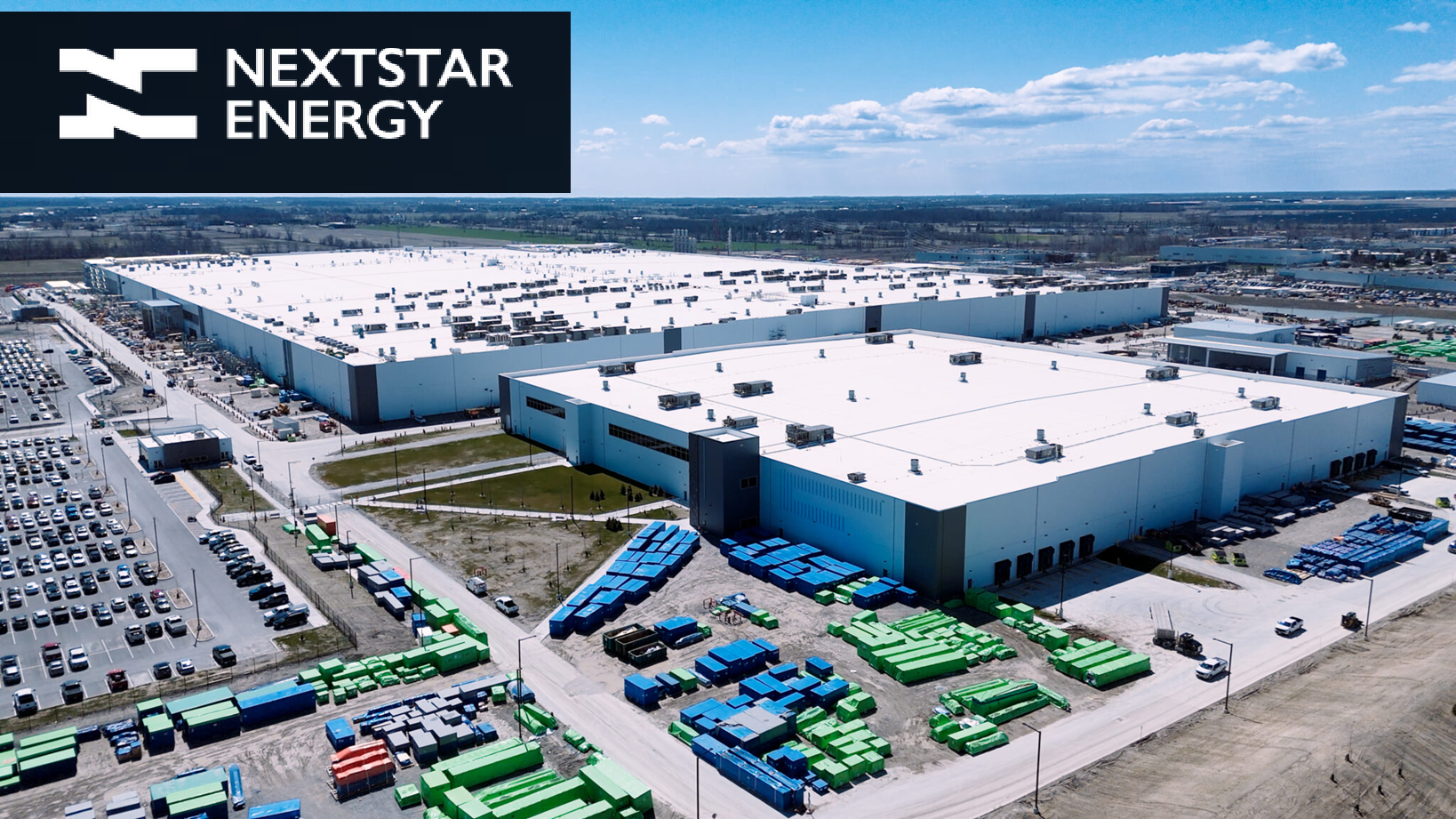 Aerial view of large Nextstar Energy industrial complex with white and blue buildings