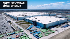Aerial view of large Nextstar Energy industrial complex with white and blue buildings