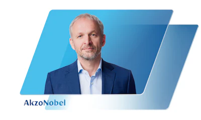 AkzoNobel executive in blue suit against blue gradient background