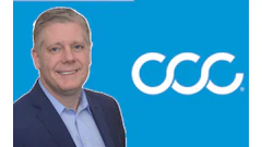 Professional businessman posing next to CCC corporate logo