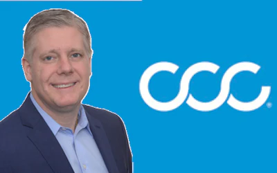 Professional businessman posing next to CCC corporate logo