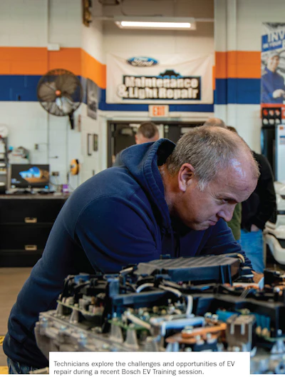Automotive technician examining electric vehicle components during Bosch EV training