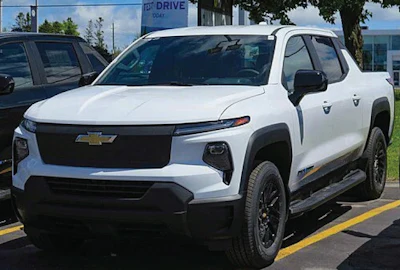 White Chevrolet Silverado pickup truck parked in dealership lot