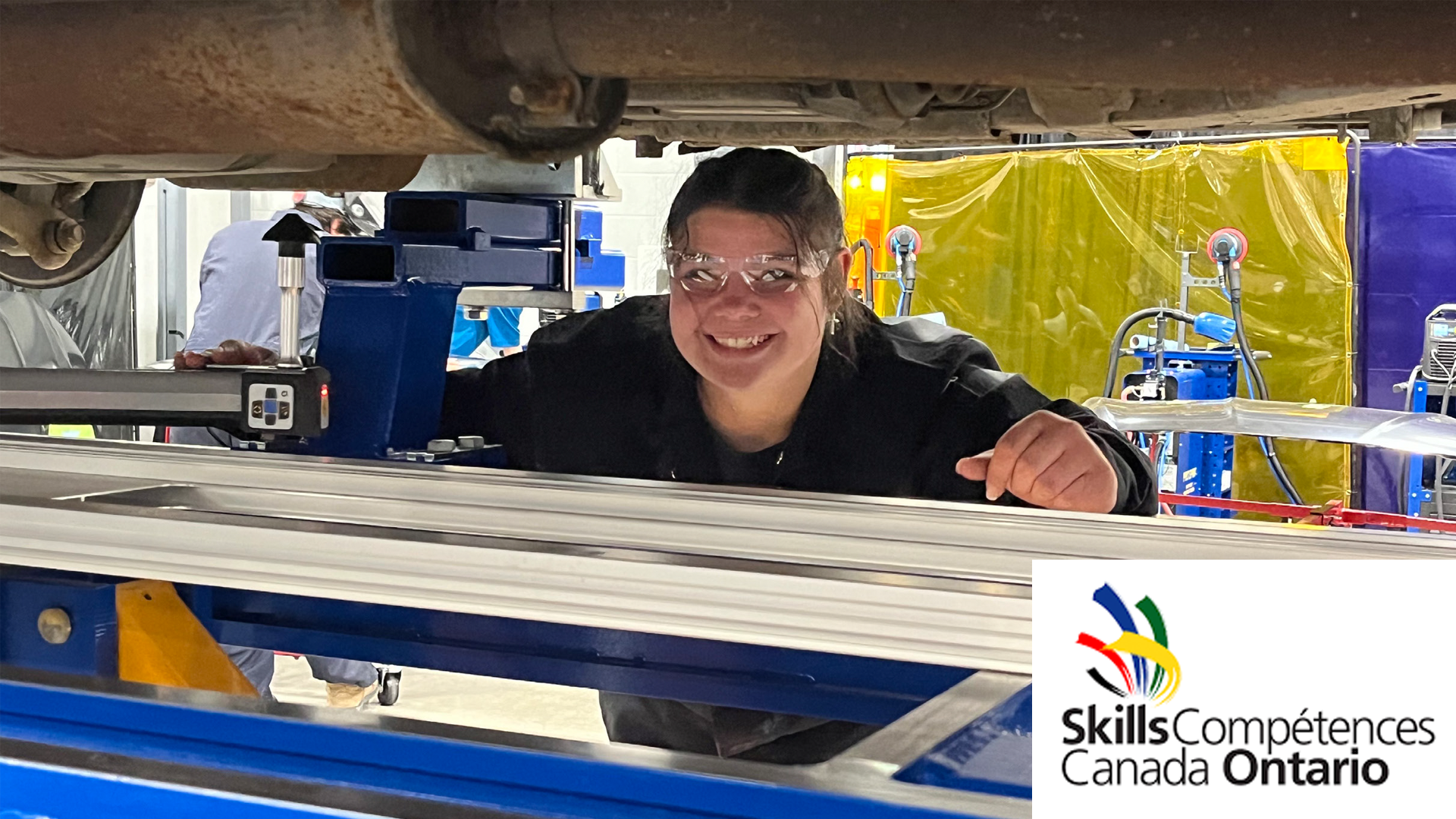 Smiling technician working at Skills Canada Ontario workshop station