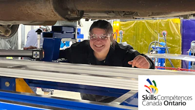 Smiling technician working at Skills Canada Ontario workshop station