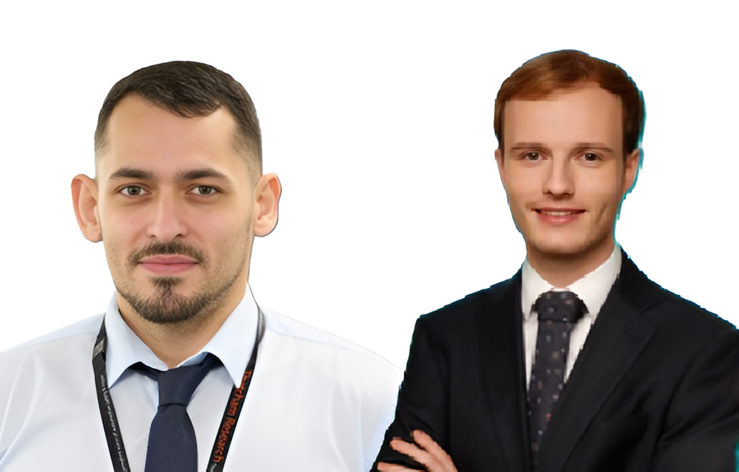 Two professional men in white and black business attire, smiling