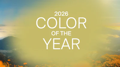 2026 Color of the Year graphic with soft landscape and flower-filled background