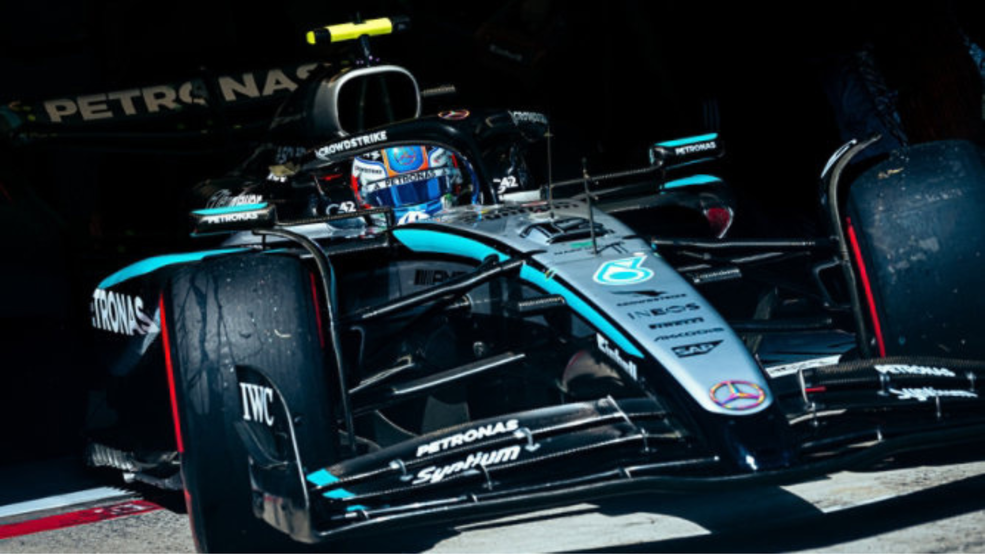 Mercedes-AMG Petronas Formula One racing car on track with team livery