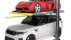 Red Porsche sports car and white Range Rover SUV on a two-level car lift