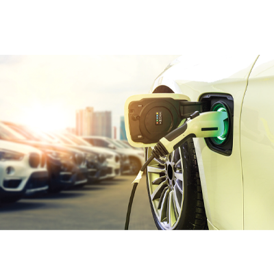 Electric vehicle charging at parking lot with urban background