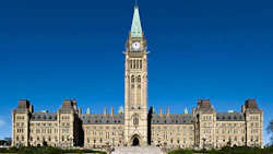 Canadian Parliament Centre Block with Peace Tower on bright blue sky day