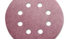 Pink circular sanding disc with 8 evenly spaced holes