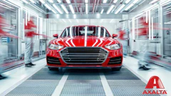 Bright red sports sedan in sleek automotive testing facility with Axalta branding