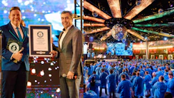 Guinness World Records ceremony with large crowd in blue attire and celebratory backdrop