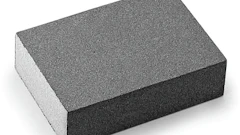Gray rectangular sanding block with textured surface