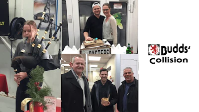 Budds' Collision team photo with employees in workshop, holiday decorations
