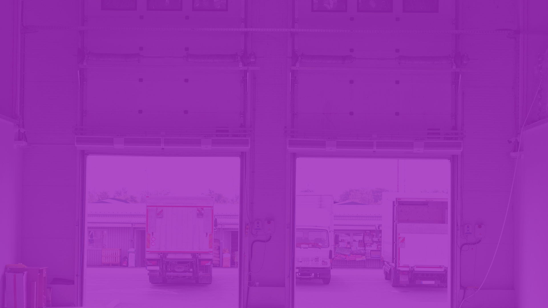 Warehouse interior with trucks and purple color filter