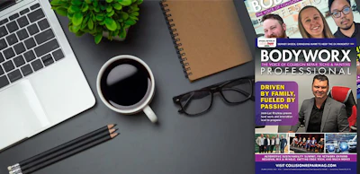 Workspace desk with laptop, coffee, magazine, and office accessories