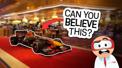 Red Bull Formula 1 race car on red carpet with surprised cartoon character