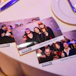 Holiday party photo booth prints from Réseau FIX team event in 2025