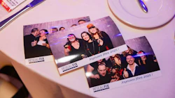 Holiday party photo booth prints from Réseau FIX team event in 2025