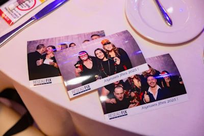 Holiday party photo booth prints from Réseau FIX team event in 2025