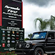 Black Mercedes-Benz G-Class SUV parked at certified collision repair center