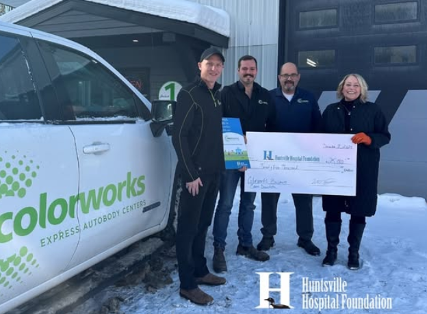 Colorworks team presenting donation check to Huntsville Hospital Foundation