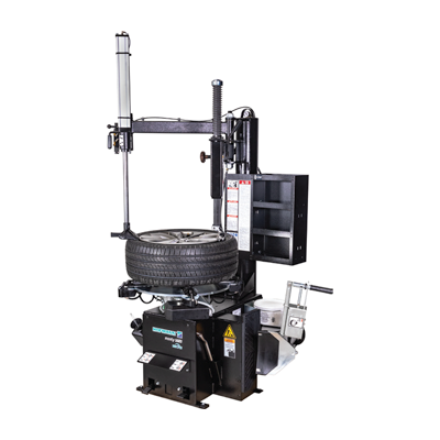 Automotive tire changing machine with black metal frame and mounting equipment