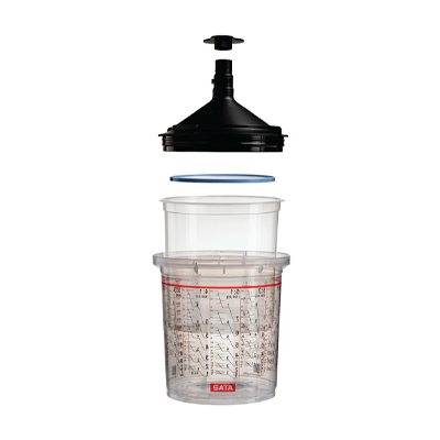 Clear kitchen measuring cup with black funnel lid and measurement markings