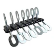 Adjustable metal clamps or clips arranged in a row on a mounting bar