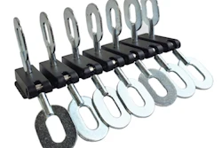 Adjustable metal clamps or clips arranged in a row on a mounting bar
