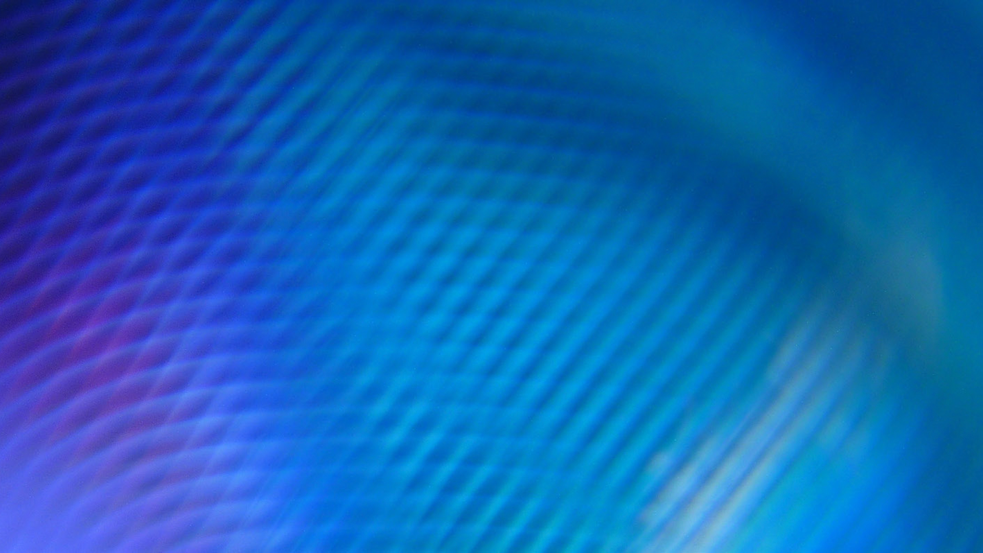 Abstract blue and purple gradient with diagonal wavy lines and soft blurred texture