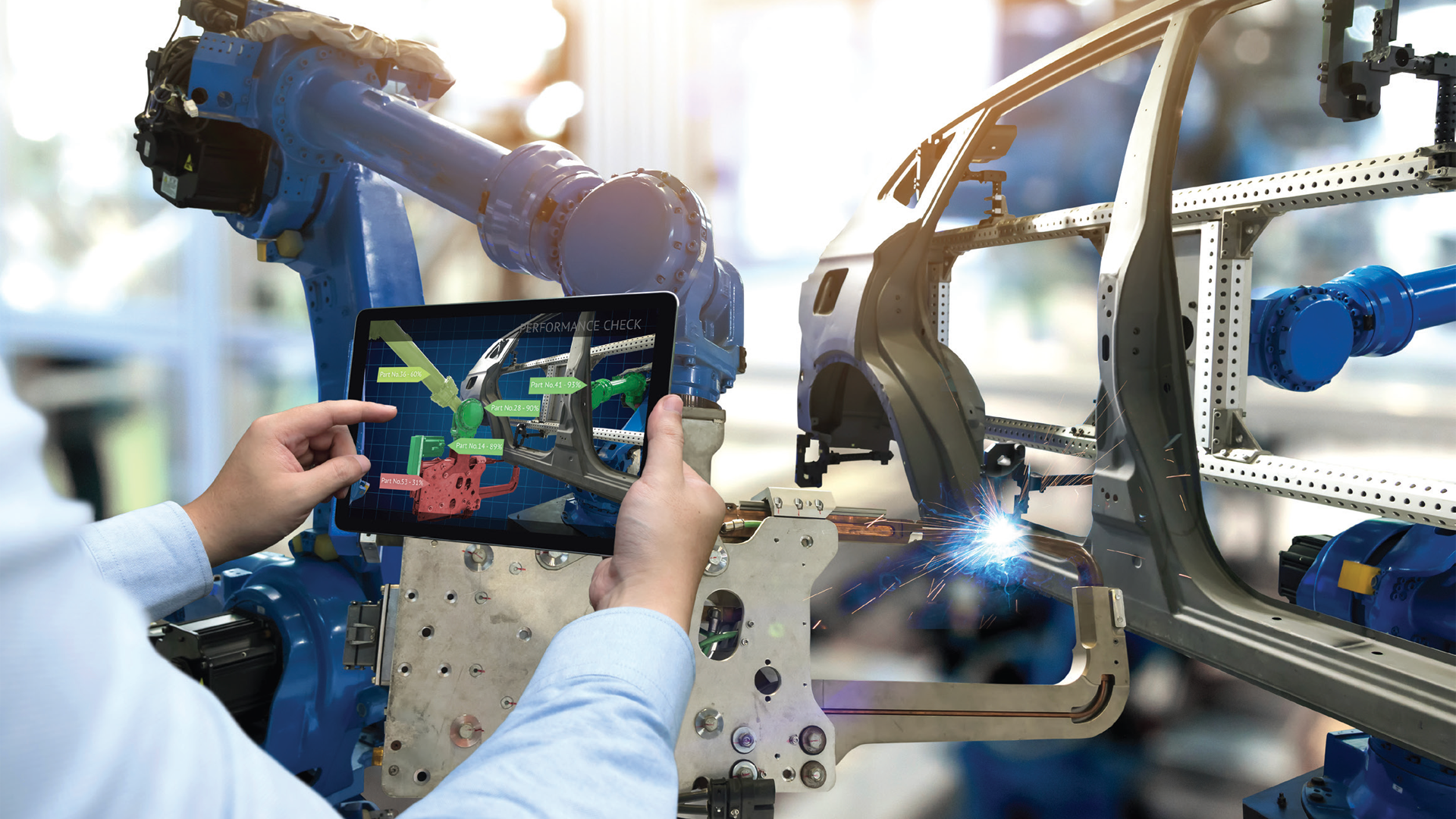 Industrial robot arm with AR tablet showing manufacturing process visualization
