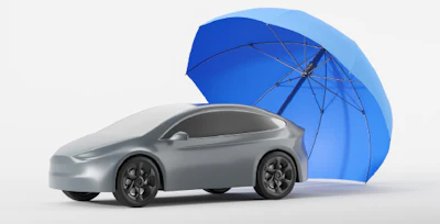 Silver electric car sheltered by large blue umbrella on white background