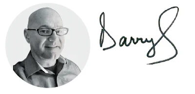 Bald professional wearing glasses in circular black and white portrait
