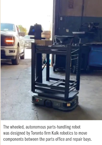 Autonomous wheeled robot in warehouse moving parts between repair bays