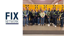 Fix Network team in high-visibility vests standing together in industrial setting