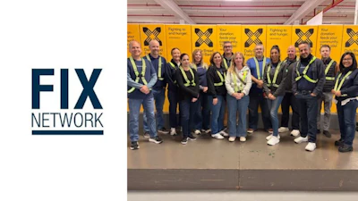 Fix Network team in high-visibility vests standing together in industrial setting