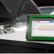 Bosch diagnostic tool ADS 625X on workbench with automotive equipment