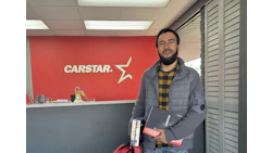 CARSTAR automotive service center reception area with employee