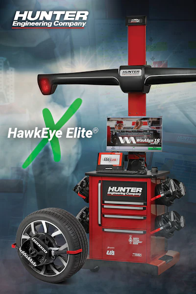 Hunter HawkEye Elite wheel alignment machine with digital display and automotive wheel