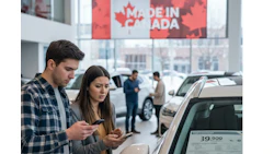 Customers examining car in Canadian dealership with Made in Canada banner