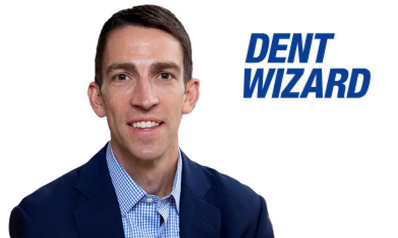 Professional man in blue suit and checkered shirt smiling