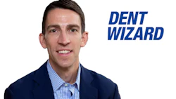 Professional man in blue suit and checkered shirt smiling