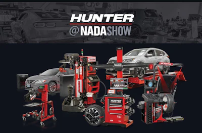 Hunter automotive equipment display with wheel balancers, lifts, and service tools at NADA Show