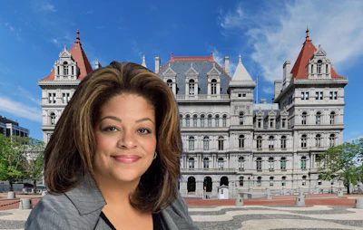 Professional woman in gray suit at New York State Capitol building in Albany