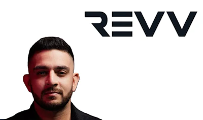 REVV logo with professional portrait against dark background