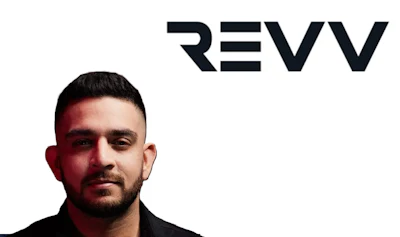 REVV logo with professional portrait against dark background